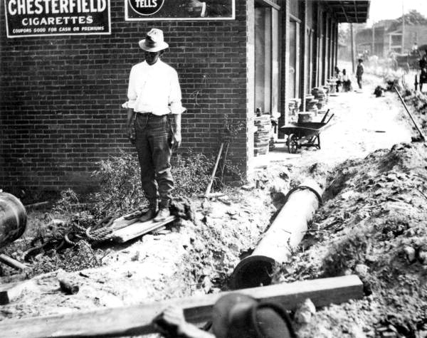 Laying 16 inch water main under sidewalk - Jacksonville, Florida