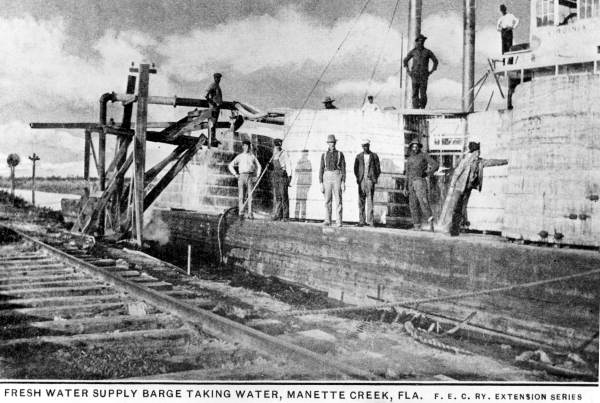 Fresh water supply barge taking on water at Manatee Creek.