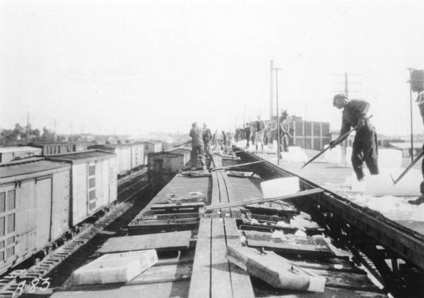 Refrigerator railroad cars being iced down