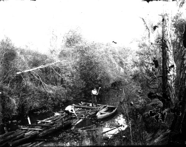 Lumbermen forming up a log raft - Alachua County, Florida