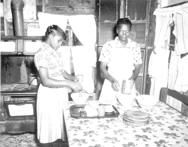 4-H club girl learning to cook - Gadsden County, Florida
