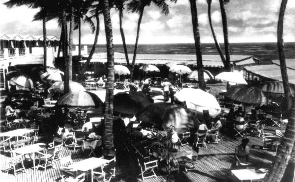 Dining under coconut palms at the Boca Raton Club.