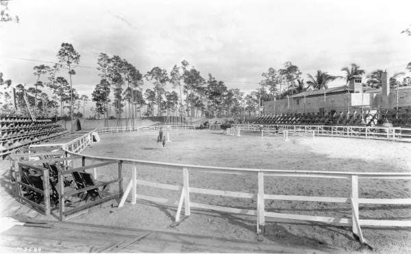Boy on horse in corral - Coral Gables, Florida