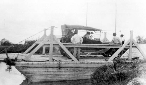 Automobile transported by ferry, on the North New River Canal - Okeelanta, Florida