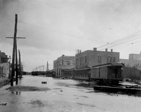 View down a flooded street, after the hurricane of 1906 - Pensacola, Florida.