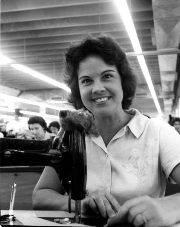 Employee of J.R. Handbags busy at work - Hialeah, Florida
