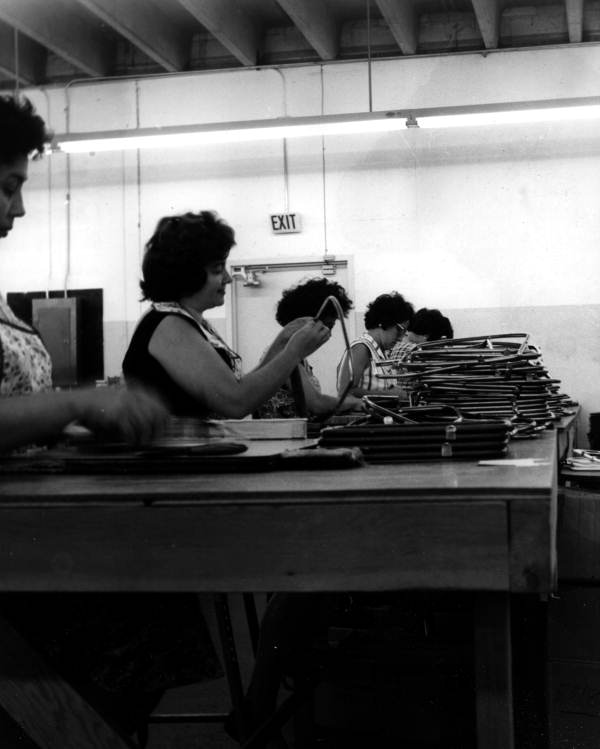 Employees of J.R. Handbags assembling handbag frames - Hialeah, Florida
