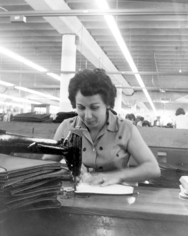 Female employee sewing for J.R. Handbags - Hialeah, Florida