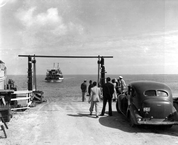 Men working on the Overseas Highway awaiting arrival of barge - No Name Key, Florida