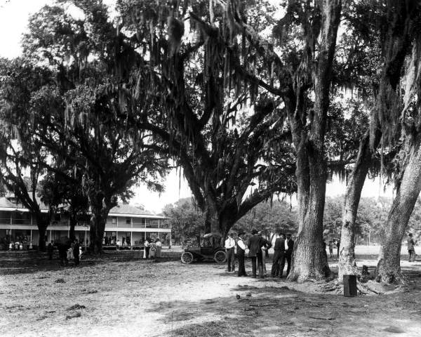 People gathered in front of the Floridatown Hotel - Floridatown, Florida.