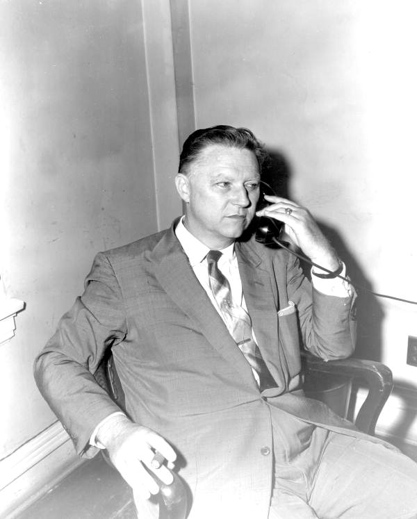 Senator Harry E. King on the phone after designation as President of the 1957 Senate.