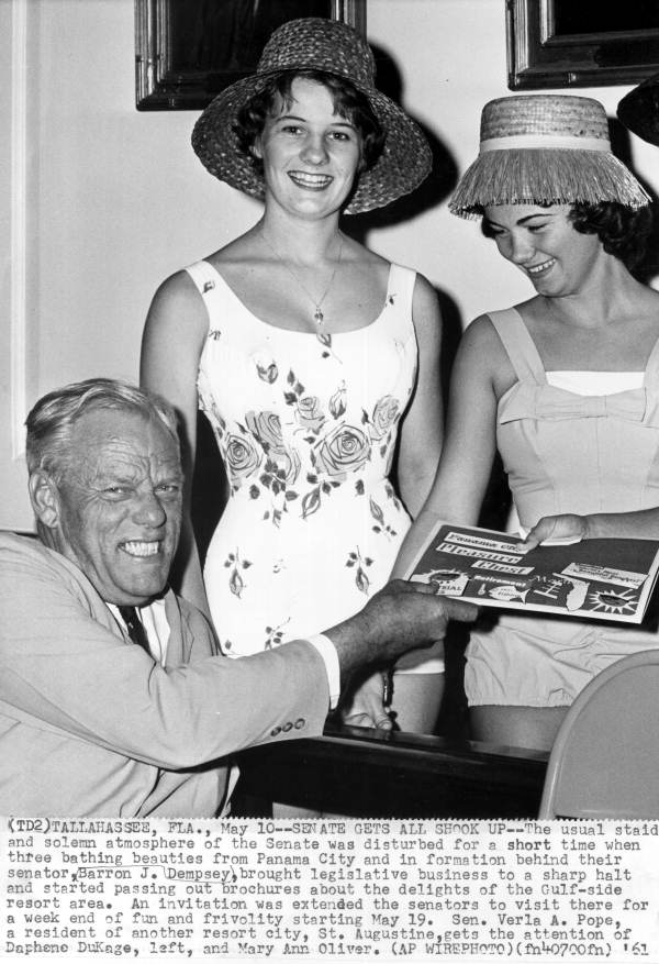 Senator Pope gets a tour brochure from a young woman in the Senate - Tallahassee, Florida.