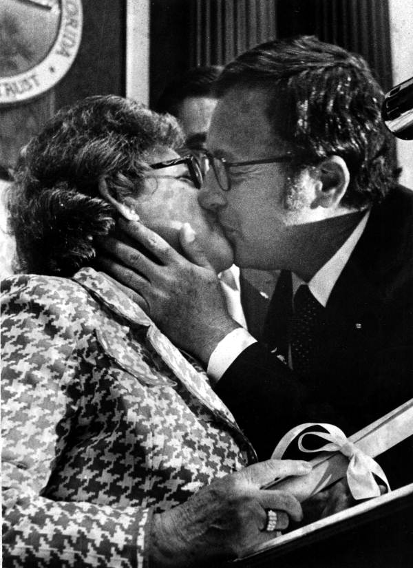 Resigning Secretary of State Dick Stone kissing his successor Mrs. Dorothy Glisson after she was sworn in - Tallahassee, Florida.