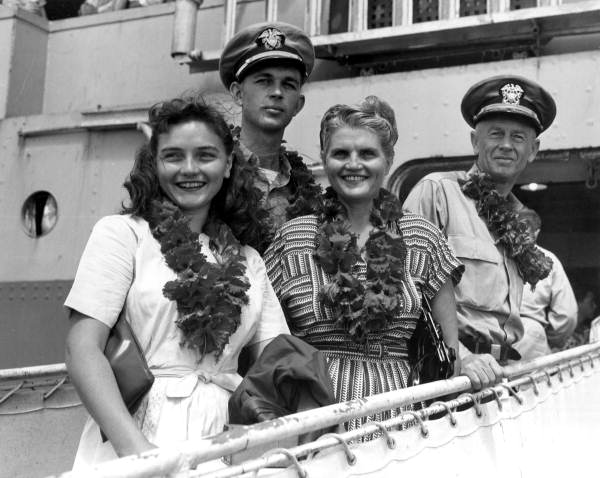 Commodore Gallemore with his family and Ensign Tucker aboard the U.S.S. General Randall in Guam