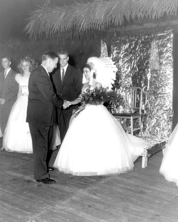 Florida State University homecoming queen Anne Yates shaking hands with Governor Charley Johns - Tallahassee, Florida.