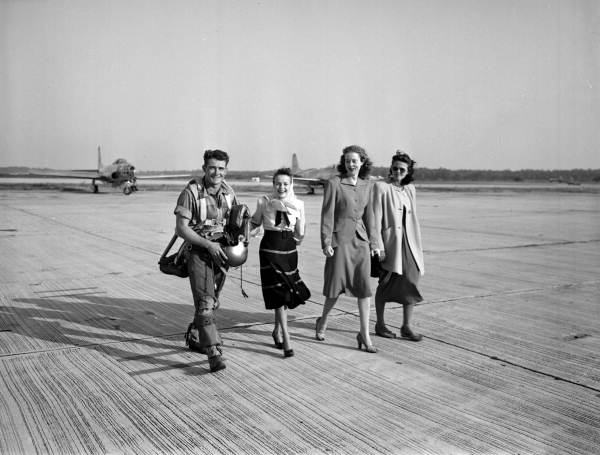 Unidentified National Guard pilot walking with women - Jacksonville, Florida.