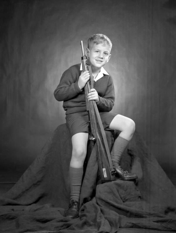 Portrait of Taylor Noegel holding a rifle - Tallahassee, Florida.