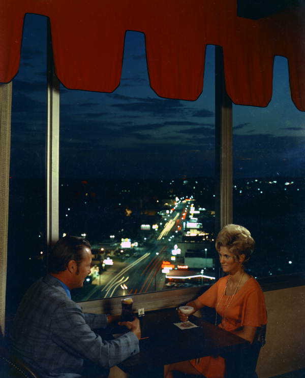 People having beverages in the Holiday Inn lounge overlooking Tennessee Street - Tallahassee, Florida.