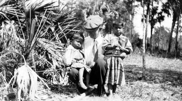 Dr. W. Stanley Hanson with Seminole children at a temporary camp in Immokalee, Florida.
