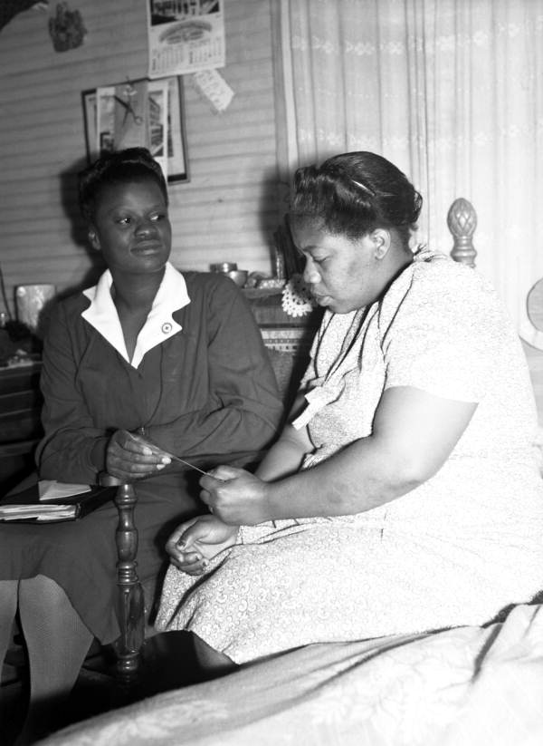 Public health nurse with a patient in Miami, Florida.