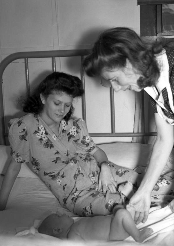 Public health nurse with mother and child in Miami, Florida.