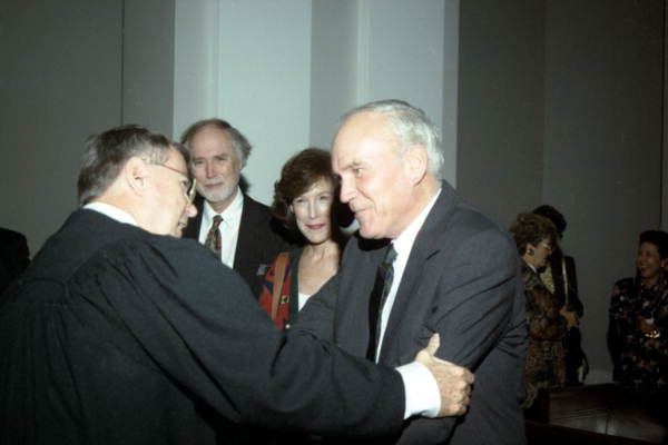 Newly sworn-in Justice Harry Lee Anstead being congratulated by Judge McClure during the investiture ceremony at the Supreme Court Building in Tallahassee, Florida.