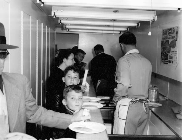 Patrons move through a mobile kitchen