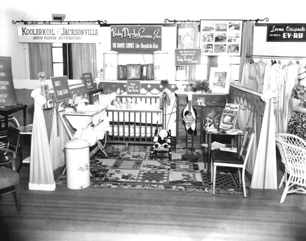 Woman's club display on baby products.