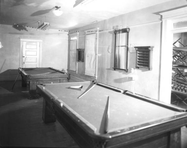Pool tables inside the Young Men's Hebrew Association building.