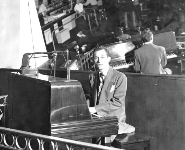 H. C. Minti at the piano?