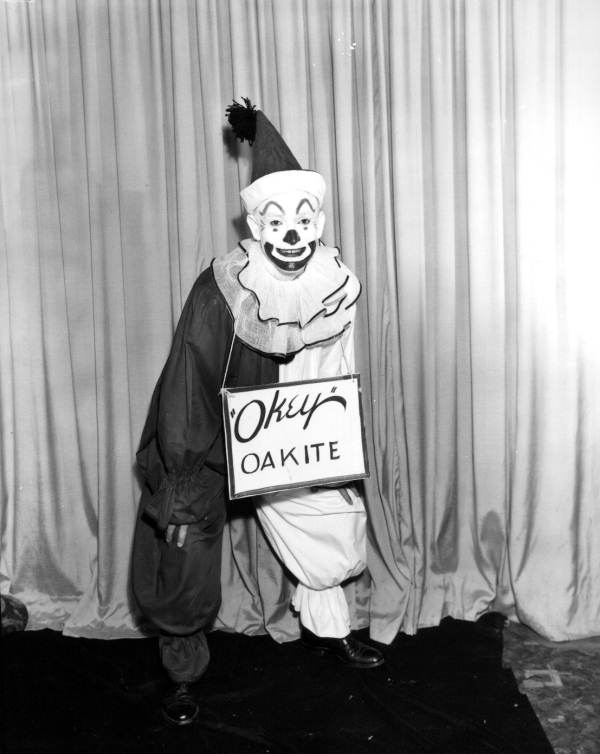 Clown with sign.
