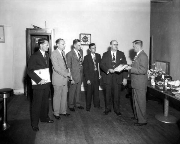 Man receiving recognition at the Gulf Oil luncheon