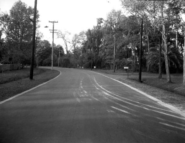 Street through residential neighborhood.