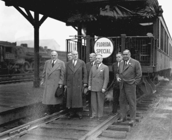 Men standing with the Florida Special train.