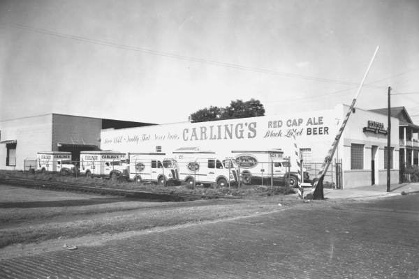 Fleet of trucks next to Seaboard Beverage Company.