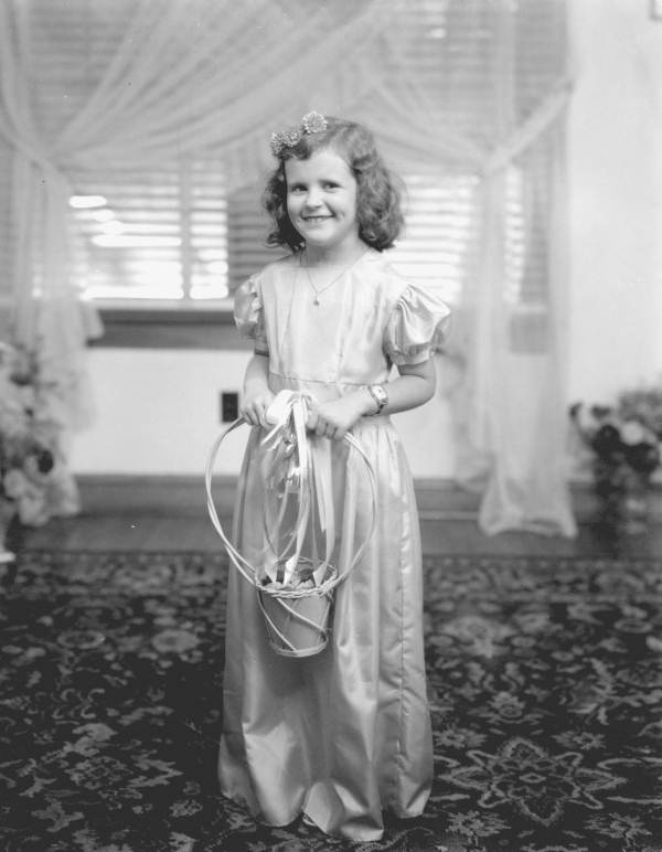 Wedding portrait of a flower girl.