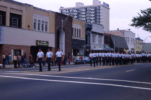 Military personnel marching in a parade on Monroe St. in downtown Tallahassee, Florida.