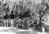 Camp members exercising their arms