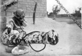 Man in diving suit posing next to cannon at McKee's Museum of Sunken Treasure - Plantation Key, Florida