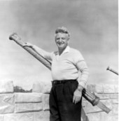 Art McKee posing with ceremonial gun at his museum - Plantation Key, Florida