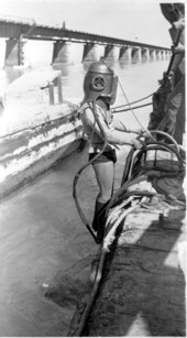 Treasure hunter Art McKee in dive gear to repair pipeline - Moser Channel, Florida