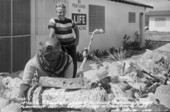 Postcard of treasure hunter Art McKee standing in front of his museum - Plantation Key, Florida