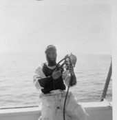 Treasure hunter Burt Webber putting on his diving suit