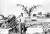 Art McKee's son, Wayne, posing at his father's museum - Plantation Key, Florida