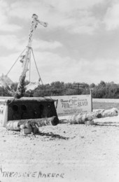 Postcard of first museum sign, anchor & cannons.