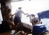 Hoisting the 80 lb. silver bar aboard Polaris.
