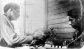 Tommie Buster and Henry Jumper playing checkers at the mission
