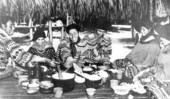 A Seminole family at dinner in the Florida Everglades.
