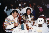 Seminole couple dining at annual Seminole Christmas party banquet in Fort Lauderdale.