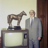Peter A.B. Widener III with statuette of "Citation" at the Hialeah Racetrack.